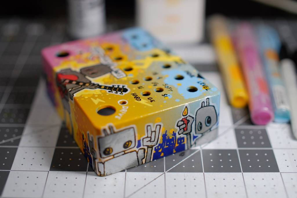 Photograph of painted guitar foot switch box without electronics installed